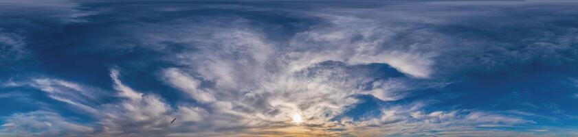 Sunset sky panorama with Cirrus clouds in Seamless spherical equirectangular format. Complete zenith for use in 3D graphics, game and for composites in aerial drone 360 degree panoramas as a sky dome photo