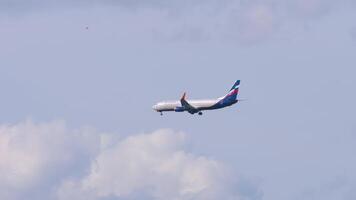 MOSCOW, RUSSIAN FEDERATION - SEPTEMBER 12, 2020. Boeing 737, VP-BNC of Aeroflot approaching landing, long shot. Plane arriving. Passenger airplane flying, blue cloudy sky video