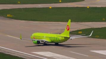 SOCHI, RUSSIA - JULY 30, 2022. Aircraft Boeing 737 of S7 Airlines RA-73671 taxiing on the runway at Sochi airport. The plane is ready to take off. Tourism and travel concept. video