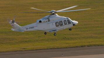 KAZAN, RUSSIAN FEDERATION, AUGUST 5, 2022. Helicopter Agusta-Westland AW-139 of Tulpar airlines landing in Kazan International airport video