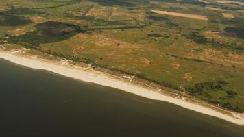 Aerial view of Baltic Sea. Revealing shot, plane flying above forest. Kaliningrad region video