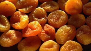 Dried apricots close-up. Apricot fruit food. Top view bowl. video