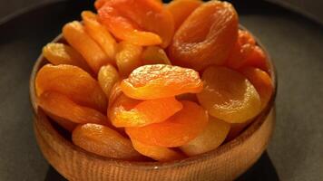 Dried apricots close-up. Apricot fruit food. Top view bowl. video