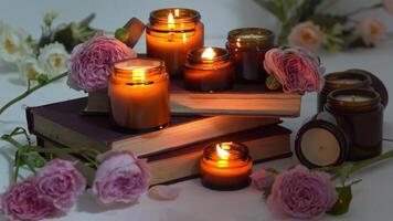 A set of different aroma candles in brown glass jars. Scented handmade candle. Soy candles are burning in a jar. Aromatherapy and relax in spa and home. Still life. Fire in brown jar video