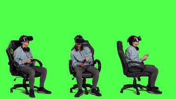 Woman celebrating her championship win with vr headset and controller, playing video games cyber space tournament against greenscreen backdrop. Gamer feeling cheerful about victory. Camera A.