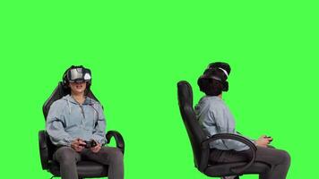 Gamer winning and losing at video games console tournament, using virtual reality interactive glasses against greenscreen backdrop. Woman feeling sad and happy about victory or failure. Camera B.