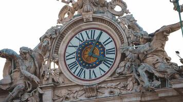 Close up view of the clock on top of the Vatican city. Timelapse of the clock arrow moving in time. Clock on facade of Saint Peter basilica. Rome, Italy video