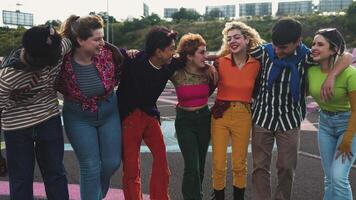 four young people are smiling and posing for a picture video