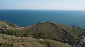 Aerial panoramic view of Balaklava landscape with boats and sea in marina bay. Crimea Sevastopol tourist attraction. Drone top view shot of port for luxury yachts, boats and sailboats. video