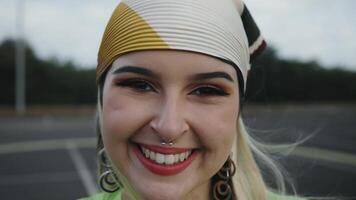 a woman with a headband smiling video