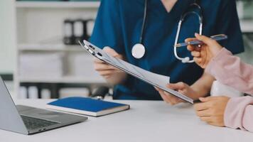 Doctor and patient discussing something while sitting at the table . Medicine and health care concept. Doctor and patient video