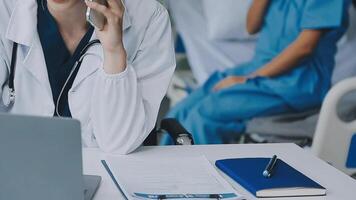 Doctor and patient discussing something while sitting at the table . Medicine and health care concept. Doctor and patient video