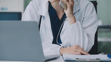 Doctor and patient discussing something while sitting at the table . Medicine and health care concept. Doctor and patient video