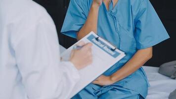 Doctor and patient discussing something while sitting at the table . Medicine and health care concept. Doctor and patient video