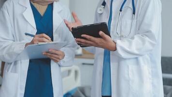 another member joining the team. Shot of two doctors shaking hands in a meeting at a hospital. video