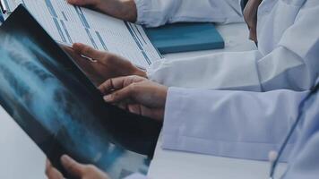 Qualified woman doctor in white uniform checking x-ray film, diagnose patient injury, smiling calm and standing isolated on studio background with copy space. Healthcare and medical insurance concept video