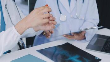 Qualified woman doctor in white uniform checking x-ray film, diagnose patient injury, smiling calm and standing isolated on studio background with copy space. Healthcare and medical insurance concept video