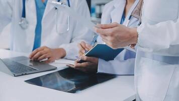 Qualified woman doctor in white uniform checking x-ray film, diagnose patient injury, smiling calm and standing isolated on studio background with copy space. Healthcare and medical insurance concept video