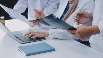 Qualified woman doctor in white uniform checking x-ray film, diagnose patient injury, smiling calm and standing isolated on studio background with copy space. Healthcare and medical insurance concept video