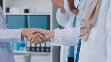 another member joining the team. Shot of two doctors shaking hands in a meeting at a hospital. video