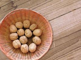 Walnuts in shell on wooden background video