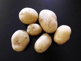 Potatoes on wooden background video