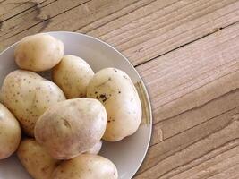 Potatoes on wooden background video