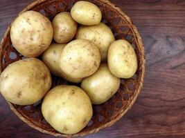 Potatoes on wooden background video