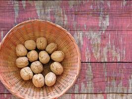 Walnuts in shell on wooden background video