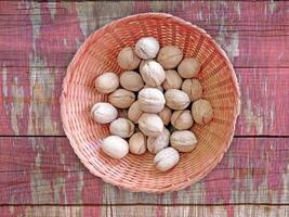 Walnuts in shell on wooden background video