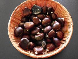 Chestnuts on wooden background video