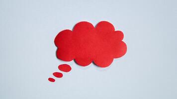 Red paper speech bubble on white background. Blank space that can be added text. photo