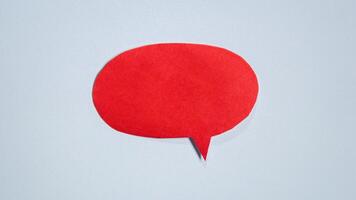 Red paper speech bubble on white background. Blank space that can be added text. photo