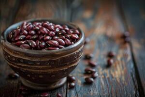 AI generated Bowl with dry kidney beans on wooden table, closeup. photo