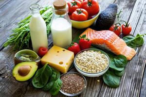 AI generated Variety of healthy foods spread out on a wooden surface. photo