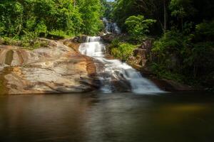 Small waterfall in the forest photo