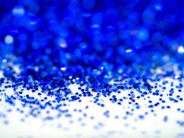 Blue sparkling glitter bokeh background. photo