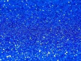 Blue sparkling glitter bokeh background. photo