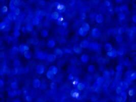 Blue sparkling glitter bokeh background. photo