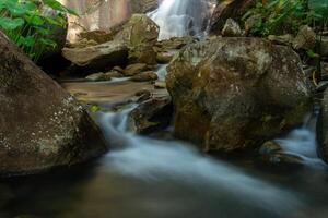 Small waterfall in the forest photo