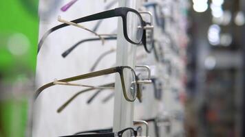 Showcase with glasses for eye correction. Optics, optical shop video