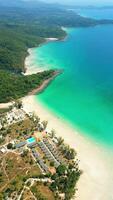 Aerial view of tropical white sandy resort beach with turquoise water in Thailand video