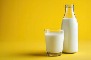 AI generated Milk in the glass and bottle on yellow background. photo