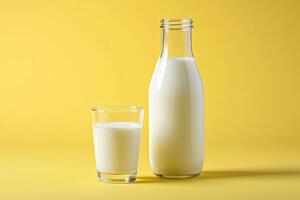 AI generated Milk in the glass and bottle on yellow background. photo
