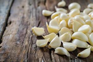 AI generated Fresh peeled garlic cloves on old wooden background. photo