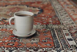 AI generated White Coffee Cup on Rug photo