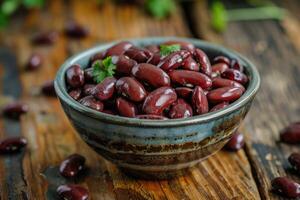 AI generated Bowl with dry kidney beans on wooden table, closeup. photo