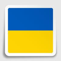 Ukraine flag icon on paper square sticker with shadow. Button for mobile application or web. Vector