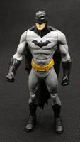 Batman action figure isolated on black background photo