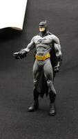 Batman action figure isolated on black background photo